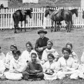 Father-Damien-with-the-Kalawao-Girls-Choir-at-Kalaupapa-Molokai-circa-1878.th.jpg